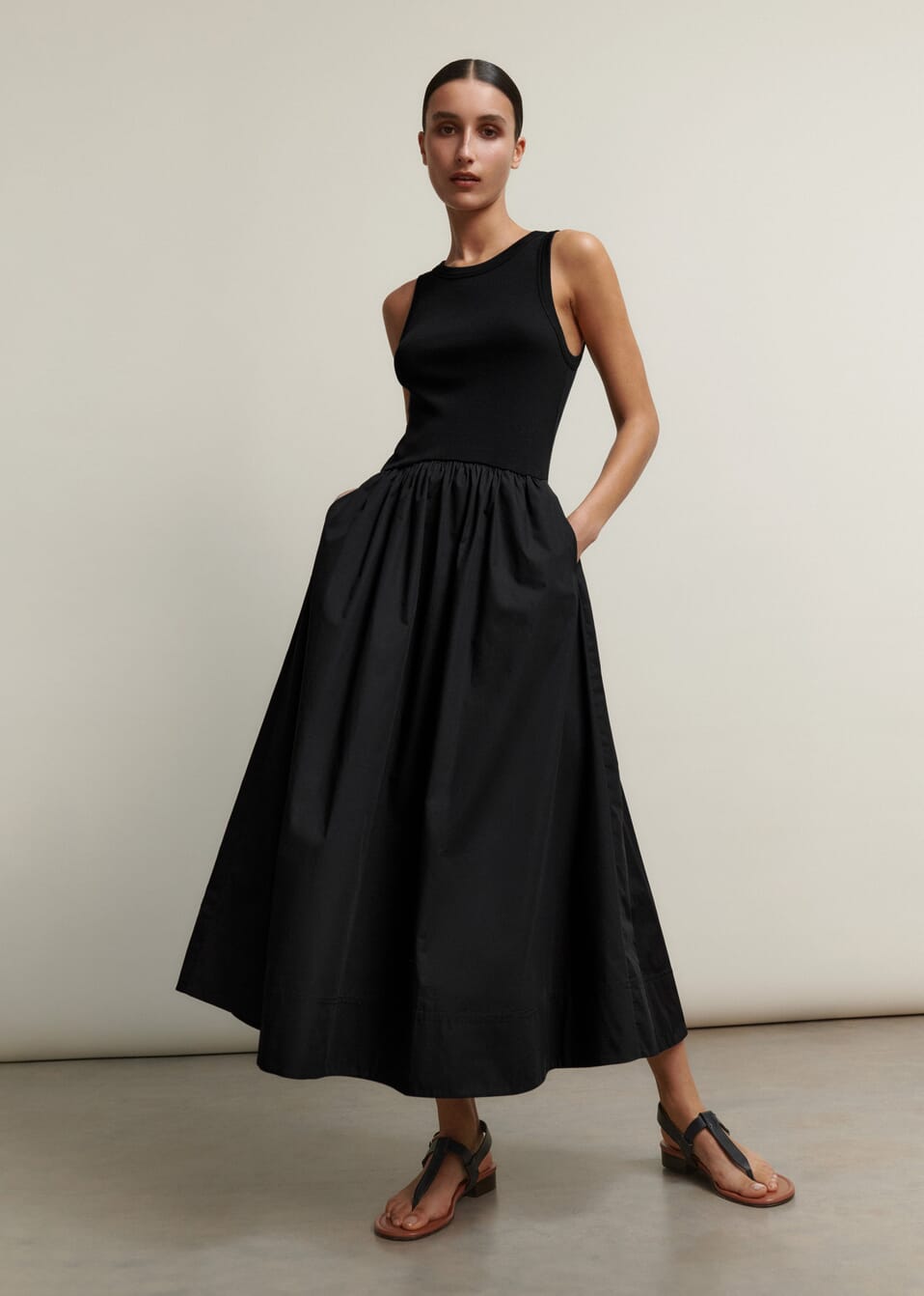 Combining the ease and versatility of a tank top with a crisp cotton skirt, this  Me + Em black dress clashes two textures in the same colour for a seamless, flattering finish.